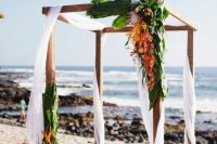 a lovely wedding arbor on a beach