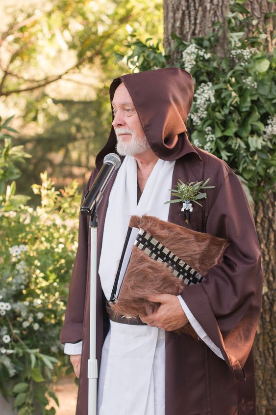 a wedding officiant styled as a Jedi for a Star Wars themed wedding