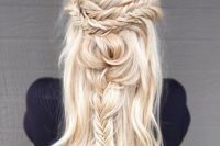 a whimsical half updo with several types of braids located horizontally and vertically, with waves