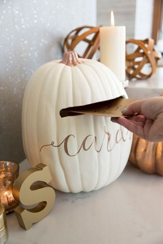 a white pumpkin with calligraphy styled as a wedding card box is ideal for a rustic fall wedding, and such a DIY doesn't require much time