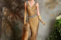 an art deco gold sequin wedding dress with embellished silver straps and a sash plus a train and a shawl