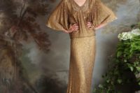 an art deco gold wedding dress with a draped bodice, an embellished neckline, wide short sleeves and a train