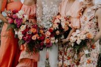 gorgeous mismatching bridesmaid dresses – solid orange ones and peachy floral ones are great for a beach wedding with a pop of color