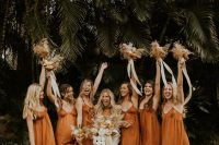 terracotta-colored maxi slip bridesmadi dresses with V-necklines are always a good idea for a beach or tropical wedding