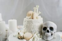 a Halloween bridal shower or wedding cake served with marshmallows, faux bones and skulls is gorgeous and non-traditional cause of its color