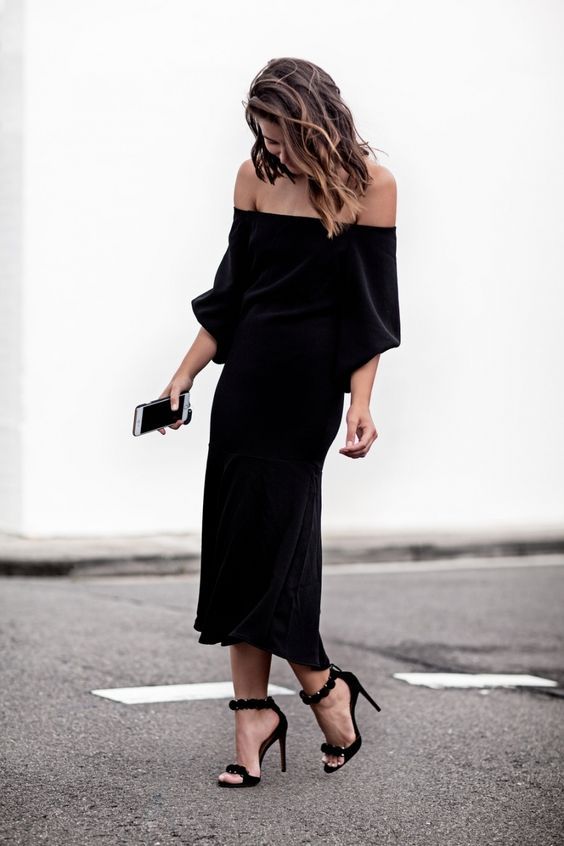 a black off the shoulder midi dress with wide sleeves and black heeled sandals is an ultimate solution for a Halloween bride-to-be
