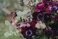 a bold fall wedding bouquet with fuchsia, plum, deep purple and mauve blooms and greenery is amazing to rock