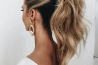 a casual low ponytail with volume on top, texture, dimension and some waves is ideal for a boho or modern bride