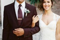 a chic plum-colored groom’s suit with a matching tie and a white shirt for an ultimately elegant groom’s look