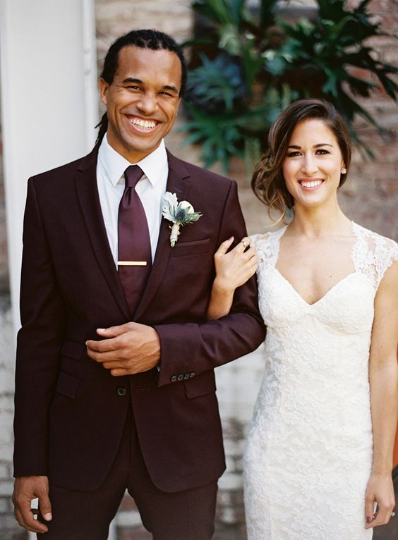 a chic plum-colored groom's suit with a matching tie and a white shirt for an ultimately elegant groom's look