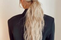 a stylish messy ponytail hairstyle for a bride