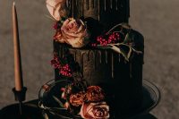 a decadent black wedding cake with drip, rust and blush blooms, greenery and berries is a fantastic idea for a Halloween wedding