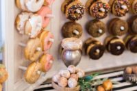 a donut wall is a must for every wedding as it’s a very hot and trendy idea and your guests will be excited for sure