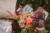 a fall woodland wedding bouquet with fall leaves, dahlias and hydrangeas will help you embrace the fall
