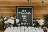 a hot chocolate bar will keep your guests cozy and happy, especially if it’s an outdoor wedding
