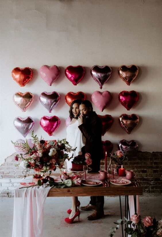 a lovely pink, silver, copper and red balloon heart wall is a great wedding backdrop or just a decoration to rock