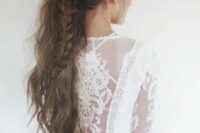 a low messy ponytail with a braid is ideal for a boho chic bride