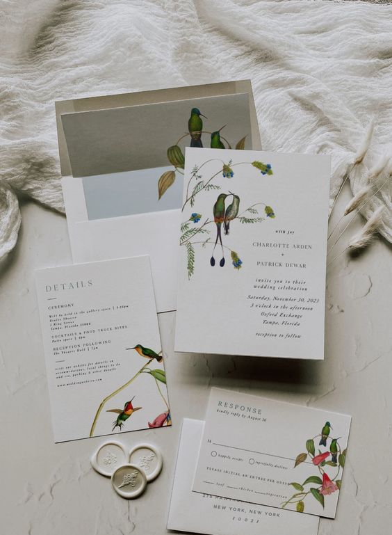 a modern wedding stationery suite with bright love birds printed is a cool idea for a wedding, it looks chic, bold and bright
