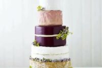 a super tall cheese tower with greenery and a heart-shaped cheese piece on top is a gorgeous idea for a modern wedding
