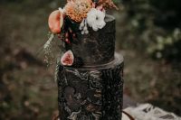 a textural and patterned black wedding cake with fresh figs and blackberries, blooms and wheat is a gorgeous idea for a fall boho wedding