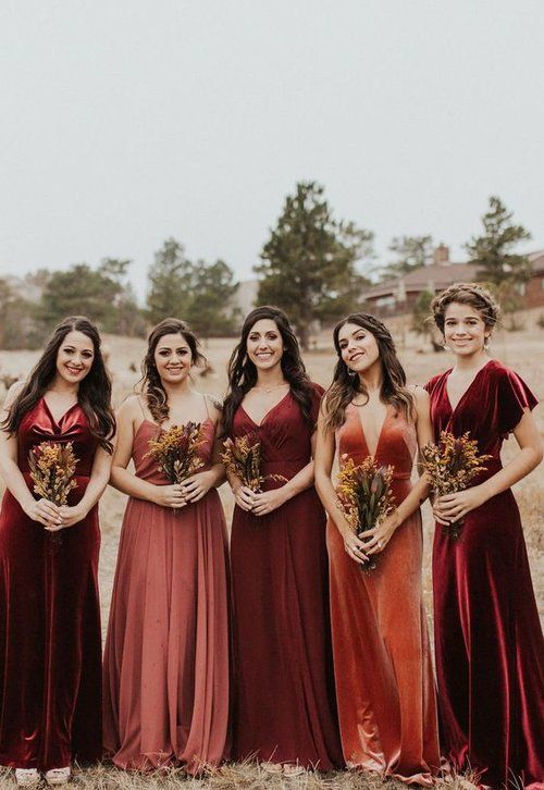 burgundy, deep red, dusty pink and orange velvet and cotton bridesmaid dresses with pleated skirts and various necklines