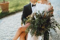 go for a greenery wedding bouquet and feathers to make your wedding look more special