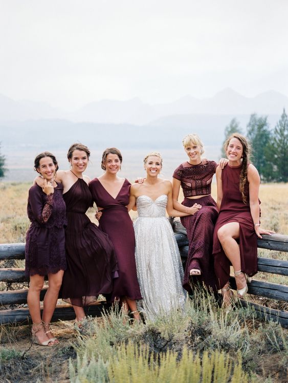 Plum colored and deep purple mismatching bridesmaid dresses are amazing for a bold fall wedding