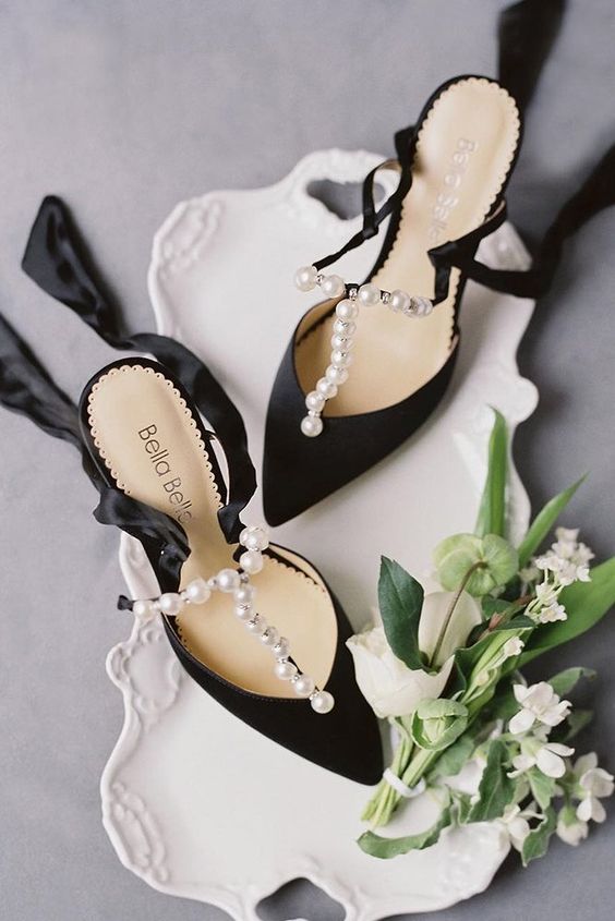 refined black shoes with pearl straps and silk ribbons are a very beautiful solution not only for a Halloween but for many other brides, too