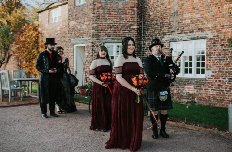 stunning off the shoulder burgundy maxi bridesmaid dresses with draped bodices and pleated skirts for a Halloween wedding
