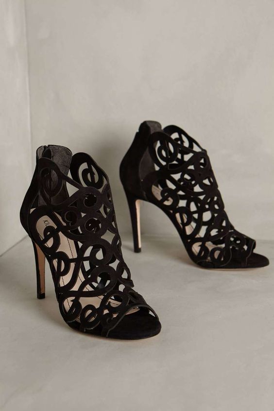 suede laser cut peep toe black booties with high heels are a gorgeous solution for a refined Halloween bridal look