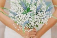 a beautiful bouquet of blue delphinium and baby’s breath looks very refreshing and cute