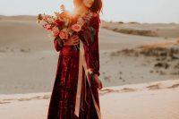 a burgundy crushed velvet maxi wedding dress with long sleeves is a fantastic idea for a desert wedding with a boho feel