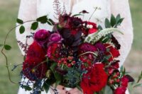 a burgundy wedding bouquet with privet berries, cherries, dark purple touches and textural greenery is a masterpiece