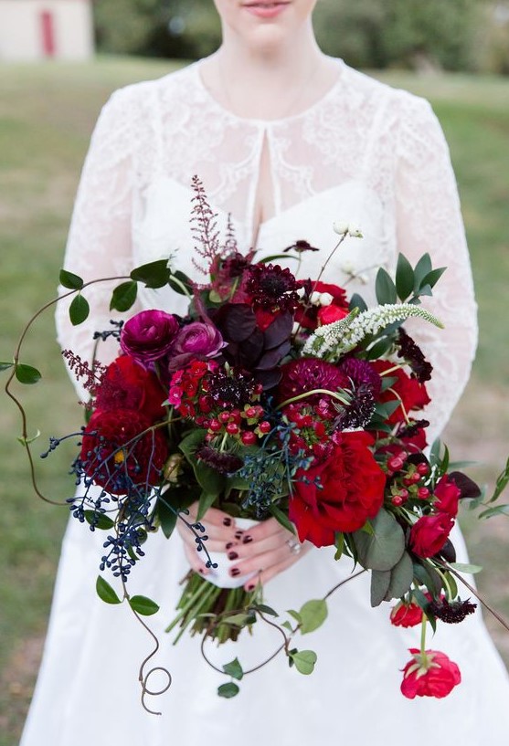 a burgundy wedding bouquet with privet berries, cherries, dark purple touches and textural greenery is a masterpiece