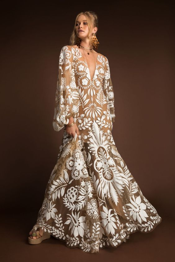 a chic boho nude lace A line wedding dress with a plunging neckline, puff long sleeves looks wow