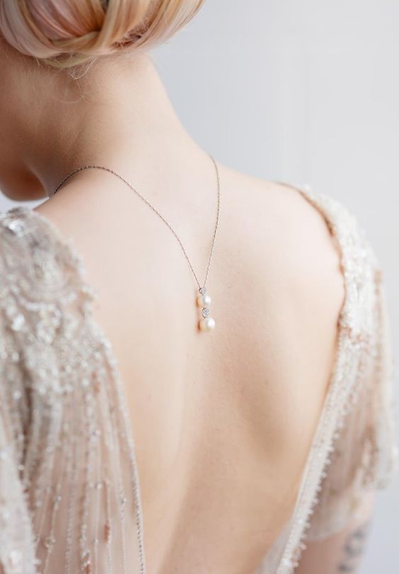 a delicate back necklace with two pearls and beads will accent your open back in the best way possible