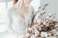 a delicate long stem wedding bouquet of cotton buds and dried flowers is a lovely idea for a delicate spring wedding