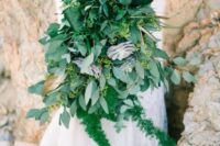 a fantastic lush wedding bouquet of various succulents, ferns and eucalyptus and much more for a tropical bride