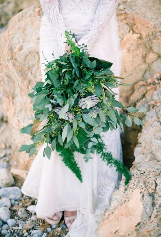 a fantastic lush wedding bouquet of various succulents, ferns and eucalyptus and much more for a tropical bride