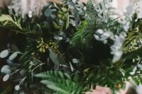 a fern and eucalyptus wedding bouquet is a lovely and textural idea that will match a minimalist bridal look easily