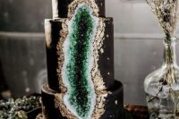 a glam black and emerald geode wedding cake with gold leaf is a stylish and cool idea