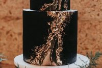 a glam black marble wedding cake with gold is a very exquisite cakery piece for a NYE wedding
