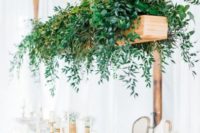 a hanging wooden box with lush greenery will instantly add freshness