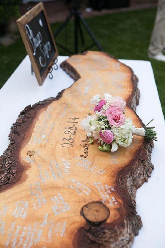 a live edge wood piece with your wedding date is to be signed by the guests and then can become an artwork
