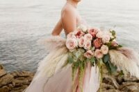 a lush and textural pastel wedding bouquet with blush and dusty pink blooms, pampas grass and greenery