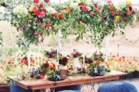 a lush greenery and bright bloom wedding decoration plus matching centerpieces