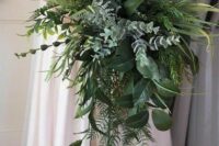 a lush textural and cascading wedding bouquet with pale greenery, ferns, foliage and other stuff