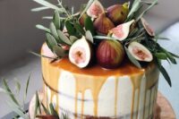 a naked wedding cake with caramel drip, greenery and fresh figs is a cozy rustic wedding dessert to rock