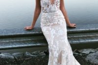 a romantic sheath nude lace wedding dress with thick straps and a deep neckline plus a train looks stunning