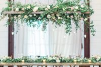 a rustic decoration with blush and white blooms and cascading greenery